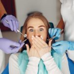 young man afraid of dentist odontophobia